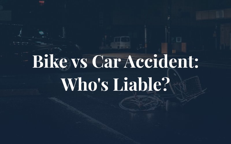 bicycle on the ground with parked car on the side with the caption: Bike Vs Car Accident: Who is Liable?