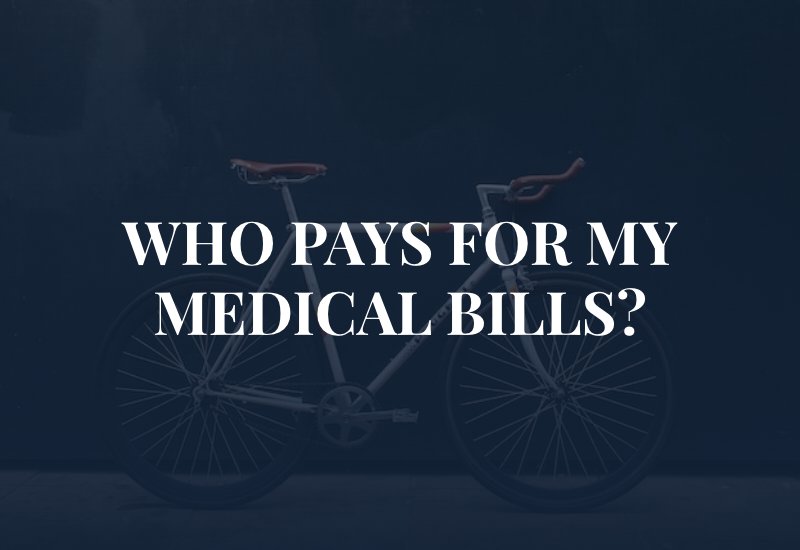 bicycle against wall with caption: Who Pays for MY Medical Bills?