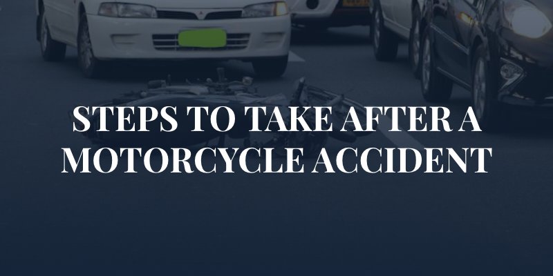 motorcycle laying on the street in traffic with the caption: "steps to take after a motorcycle accident"
